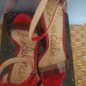 Red heels with smoke clear strap over toe